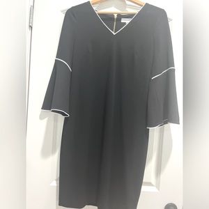 Calvin Klein size 6, Black bat wing dress with white piping.